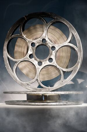 Two reels of film in smokeの写真素材