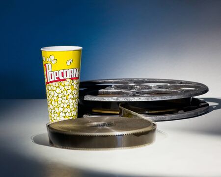 Cup for popcorn and reel of film