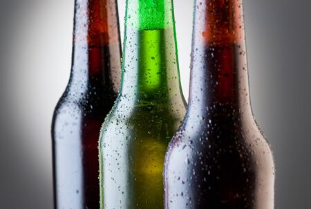 Neck of the bottles with beerの写真素材