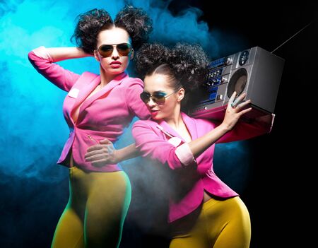 Dancing girls with a tape recorderの写真素材
