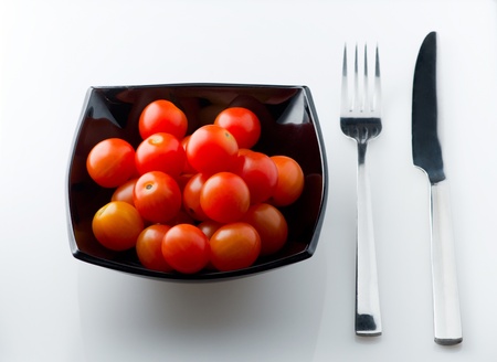 Full dish of small tomatoes の写真素材