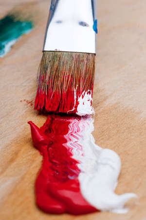 Art brush with red paintの写真素材
