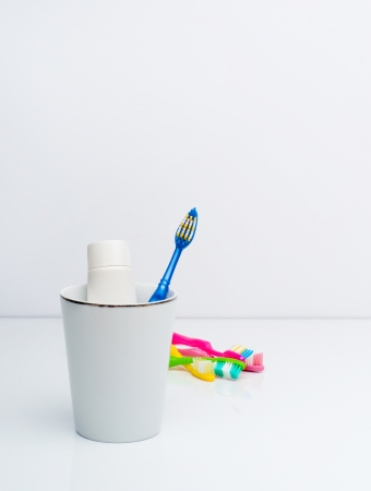 Toothbrush and toothpaste in the glassの写真素材