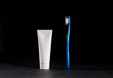 Toothbrush and toothpaste on black backgroundの写真素材