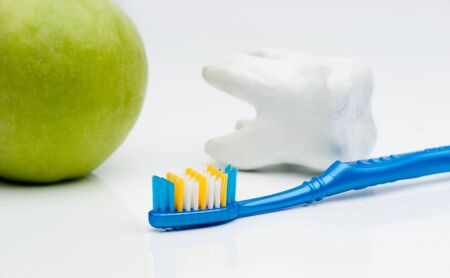 Toothbrush with green apple and toothの写真素材