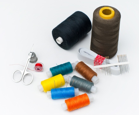 Sewing supplies on the white background