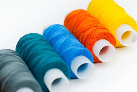 Spools of thread on white backgroundの写真素材