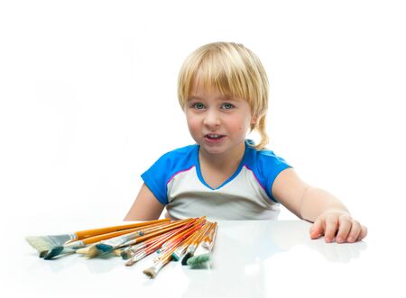 Little boy happy with paintbrushの写真素材