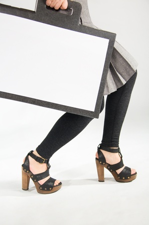 Female feet in shoes and bagの写真素材