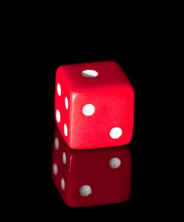 Red dice on the black backgroundの写真素材