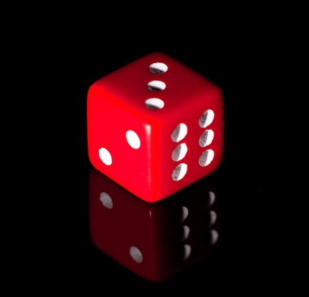 Red dice on the black backgroundの写真素材