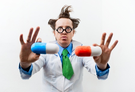 Funny doctor with pills in handの写真素材