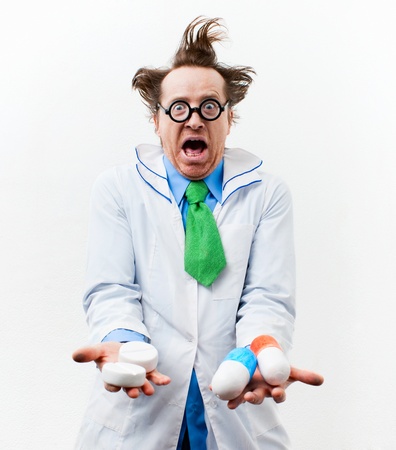 Crazy doctor with pills in handの写真素材