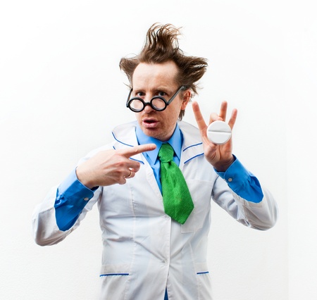 Funny doctor with pills in handの写真素材