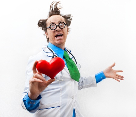 Funny doctor cardiologist with heart in handの写真素材