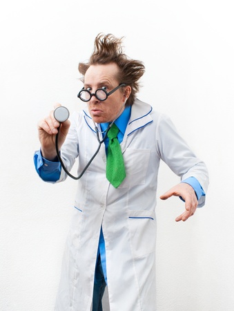 Crazy doctor listening to the stethoscopeの写真素材
