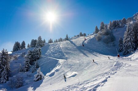 Skiers in the winter mountainsの写真素材