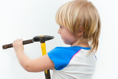 Little boy running with hammer chisel の写真素材