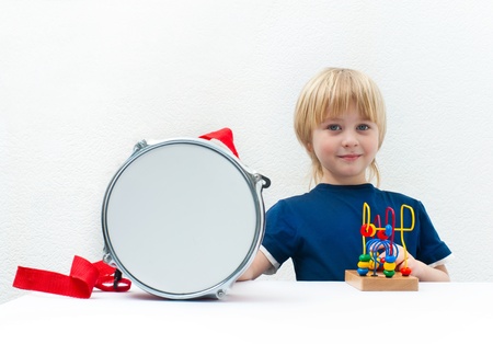 Little boy with the drum and toyの写真素材