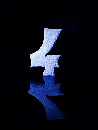 Numeral four on black background