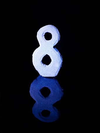 Numeral eight on black backgroundの写真素材