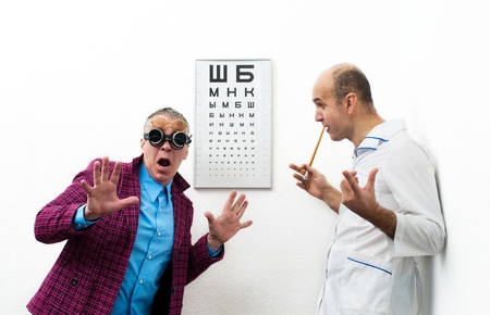 Doctor ophthalmologist and patient funnyの写真素材