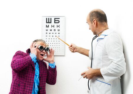 Doctor ophthalmologist and patient funnyの写真素材