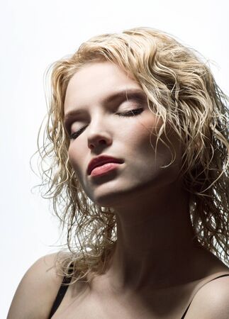 Portrait of beautiful blonde with eyes closedの写真素材