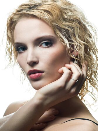 Portrait of beautiful blonde with gold ringの写真素材