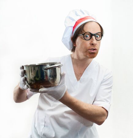 Funny chef with pan on white backgroundの写真素材