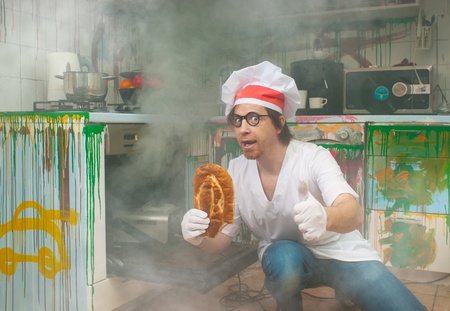 Cheerful baker bakes delicious breadの写真素材