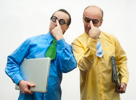 Two brainy businessman with laptopsの写真素材