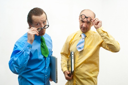 Two serious businessman with laptopsの写真素材