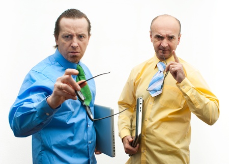Two serious businessman with laptopsの写真素材