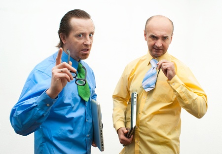 Two serious businessman with laptopsの写真素材
