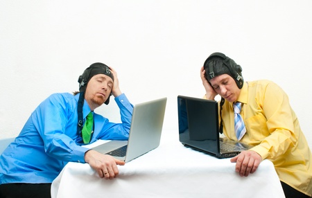 Two sleeping programmer opposite each otherの写真素材