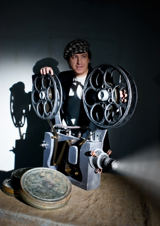 Projectionist and film projector with filmの写真素材