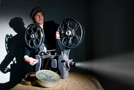 Projectionist and film projector with filmの写真素材