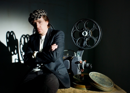 Projectionist and film projector with filmの写真素材