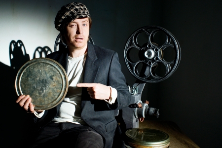 Projectionist and film projector with filmの写真素材