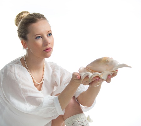 Portrait of beautiful blonde with pearls and shellの写真素材