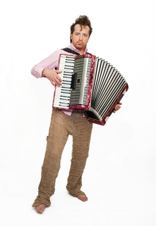 Funny musician with accordionの写真素材