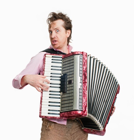 Portrait of crazy musician with accordionの写真素材