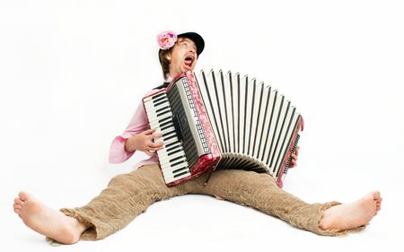 Crazy musician plays the accordionの写真素材