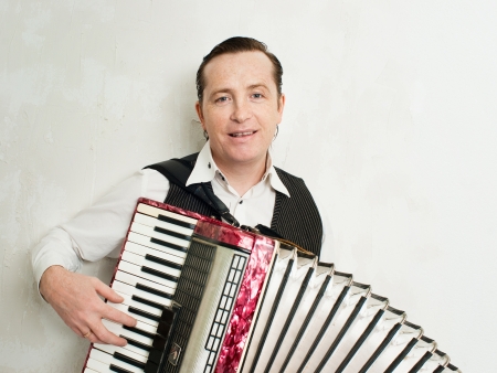 Portrait of professional musician with accordionの写真素材