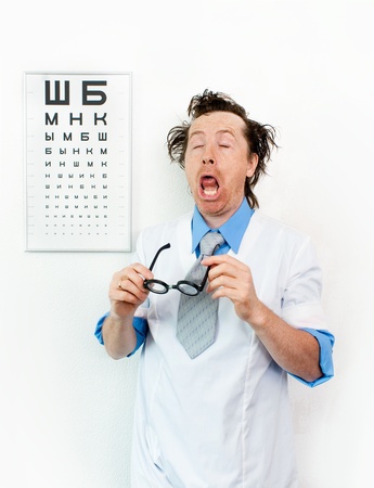 Funny oculist with eyes closedの写真素材