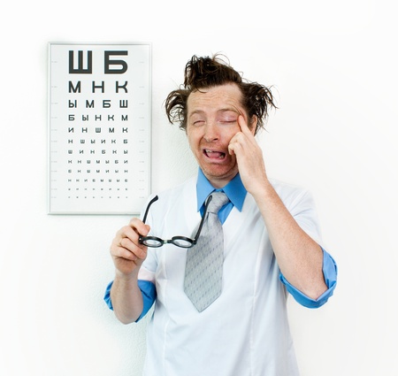 Funny oculist with eyes closedの写真素材