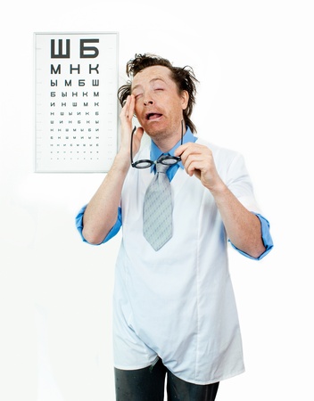 Funny oculist with eyes closedの写真素材