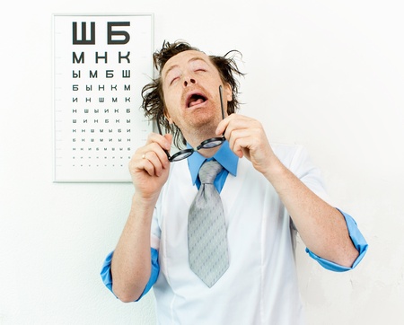 Funny oculist with eyes closedの写真素材