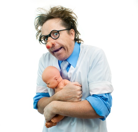 Crazy pediatrician holding a babyの写真素材